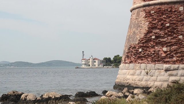 St. Nicholas Fortress in &Scaron;ibenik and lighthouse, touristic destination, Dalmatia, Croatia. UNESCO's World Heritage Site. St Anthony's Channel in Adriatic sea. Tvrđava Sv. Nikole. 