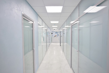 door glass plastic corridor, new office building, office rental, light blurred corridor background