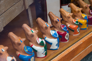 Ornamental jockey and horse sculptures for sale in a shop in Siena prior to the palio horse race