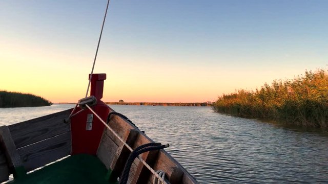 Sailing at sunset in the lagoon "La Albufera", in Valencia, Spain