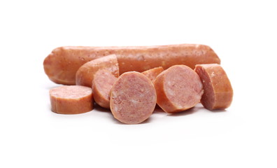 Sausages with slices isolated on white background