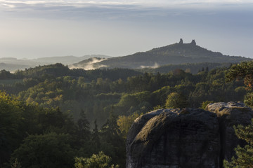 Morning view from the "Marianske" view of the ruin of castle "Trosky" during sunrise. Castle over rocks in "Cesky raj" in the Czech Republic.