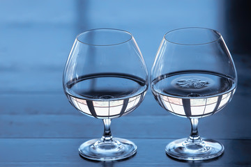 glass of white wine in the restaurant / white wine in the interior of the restaurant a table with glasses of wine, a romantic summer