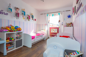 Kids bedroom interior with pastel color wallpapers