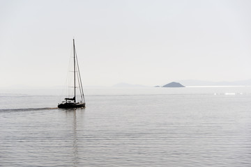 Fototapeta premium yacht in sea at sunset
