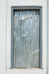 Door with zinc wall texture background