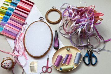 Accessories for embroidery with satin ribbons on a light table