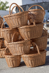 Baskets for sale stacked on top of each other  Composition in a traditional fair with artistic hand-made packaging