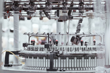 Knitted fabric. Textile factory in spinning production line and a rotating machinery and equipment production company.
