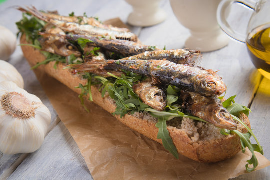 Sardine fish sandwich with garlic and olive oil