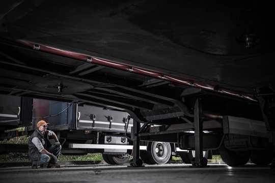 Trucker Checking Trailers
