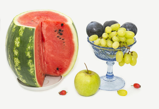 Watermelon, plums, grapes and apple