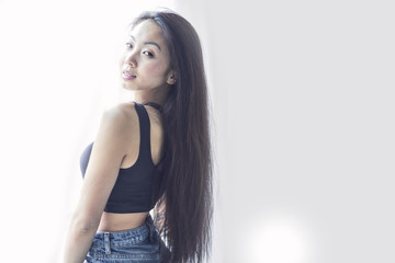 Fototapeta premium Asian woman smiling with long hair, black hair, smiling, on white background. natural make-up, beauty face