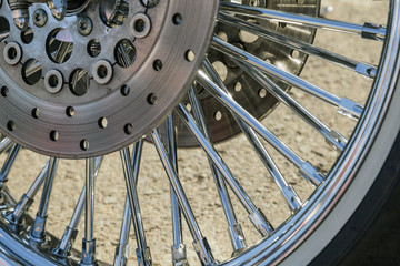 Chromed motorcycle wheels with disc brakes, close-up