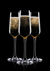 Elegant glasses of yellow champagne with bubbles
