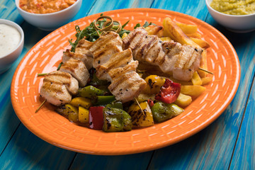 Grilled chicken meat on skewer