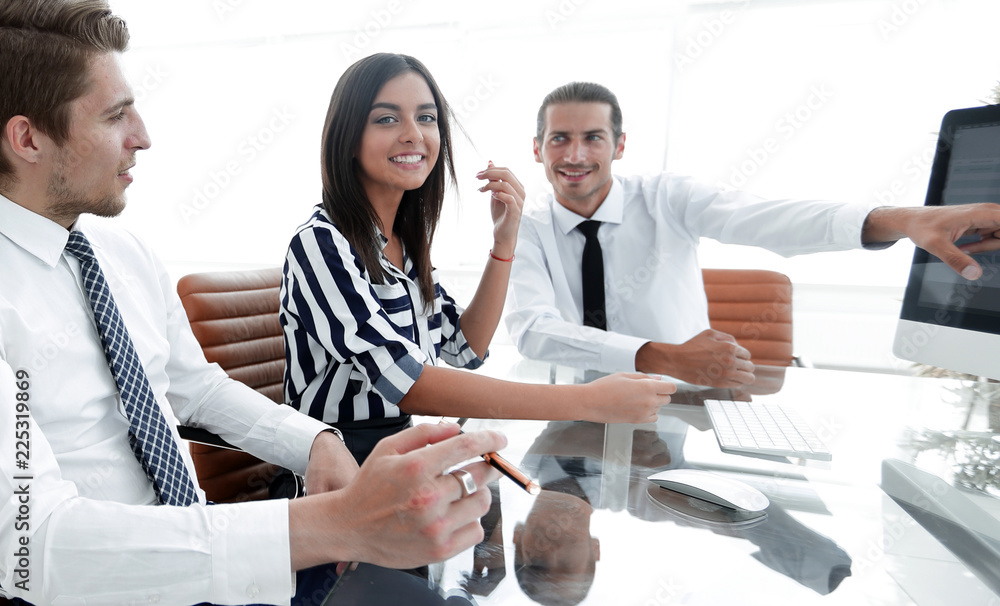 Wall mural employees discussing sales statistics.