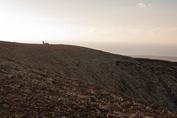 2018-07-09 fuerteventura:tourists go trekking on the top of a volcano