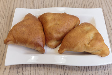 Hot tasty pies with meat, traditional English appetizer.