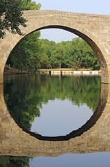 Fototapeta na wymiar Bridge, river and reflection