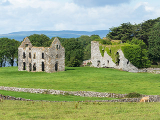Fototapeta na wymiar A view of Annaghkeen Castle, situated next to Lough Corrib in County Galway in Ireland.