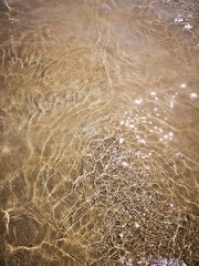 sparkling clear water on sand