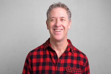 Mature hipster man wearing red checkered shirt
