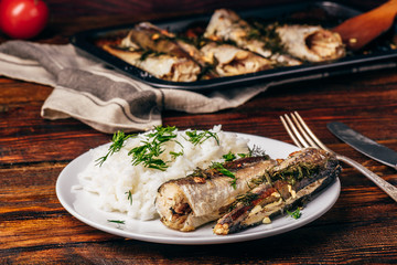 Baked hake carcasses with rice