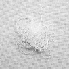 white thread on white fabric texture