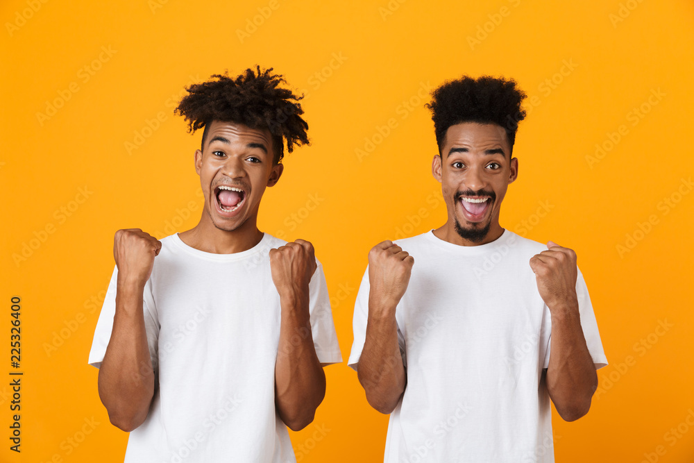 Poster Portrait of two happy male african friends in t-shirts