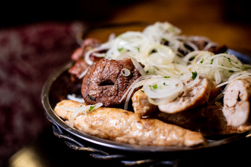 skewered onion on an iron plate
