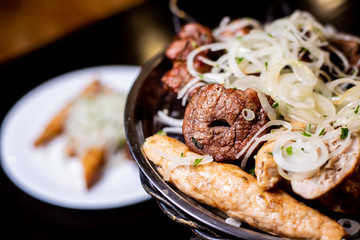 skewered onion on an iron plate