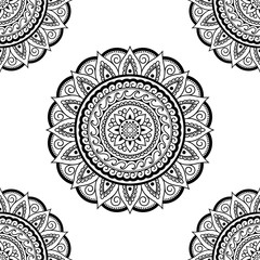Seamless decorative ornament in ethnic oriental style. Circular pattern in form of mandala for Henna, Mehndi, tattoo, decoration.