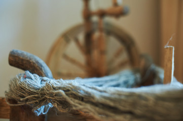 Old fashioned wooden distaff, spindle, spinning wheel.
