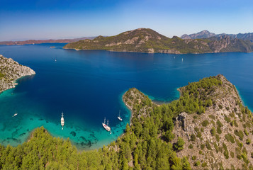 Fototapeta premium Aerial view of boats in Selimiye Cove in Turkey during Blue Voyage