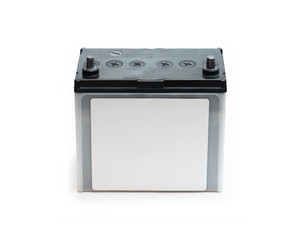 Car battery or automotive battery, with white blank label, isolated on white. Rechargeable battery.