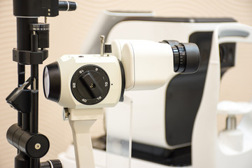 Diagnostic slit lamp in office of doctor ophthalmologist. Ophthalmic diagnostic microscopic medical equipment to diagnose cataracts, glaucoma or other eye diseases of the front part of the eye