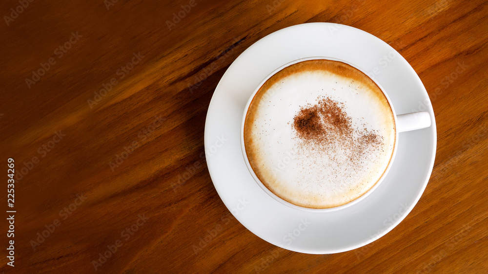 Wall mural hot coffee cappuccino latte top view on wooden background