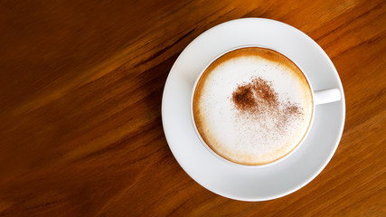 Hot coffee cappuccino latte top view on wooden background