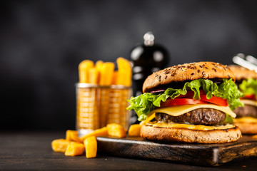 Delicious grilled burgers © George Dolgikh