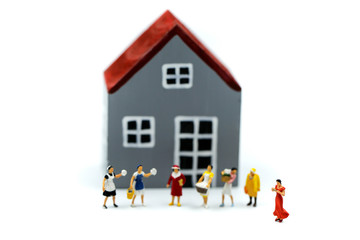 Miniature people : wife and friend with house using concpet for Housewife’s Day.
