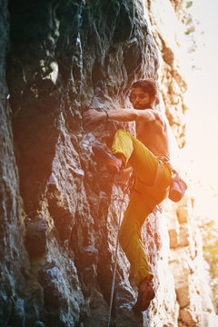 rock climbing. man rock climber climbing the challenging route on the rocky wall