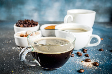Coffee cups with beans and ground coffee