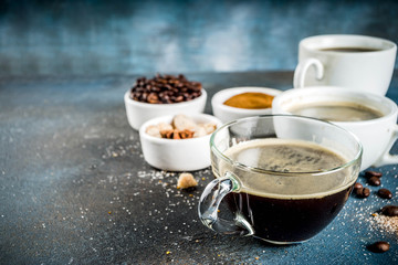 Coffee cups with beans and ground coffee