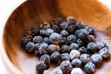 Black Raw Tapioca Pearls in Wooden Bowl.