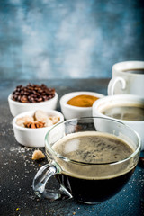 Obraz na płótnie Canvas Coffee cups with beans and ground coffee