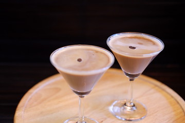 espresso martini cocktail on wood tablev