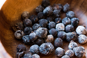 Black Raw Tapioca Pearls in Wooden Bowl.