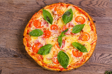 Pizza with ham and potato