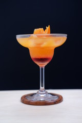orange margarita on wood table